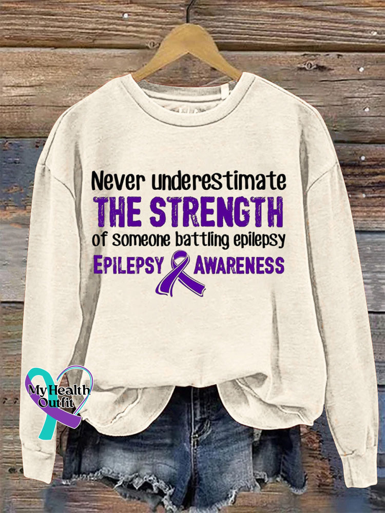 Never Underestimate The Strength Of Someone Batting Epilepsy Epilepsy Awareness Crew Neck Sweatshirt Beige / S