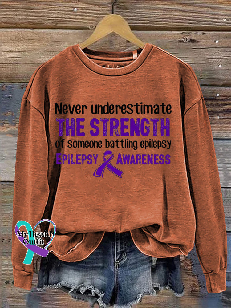 Never Underestimate The Strength Of Someone Batting Epilepsy Epilepsy Awareness Crew Neck Sweatshirt Orange / S