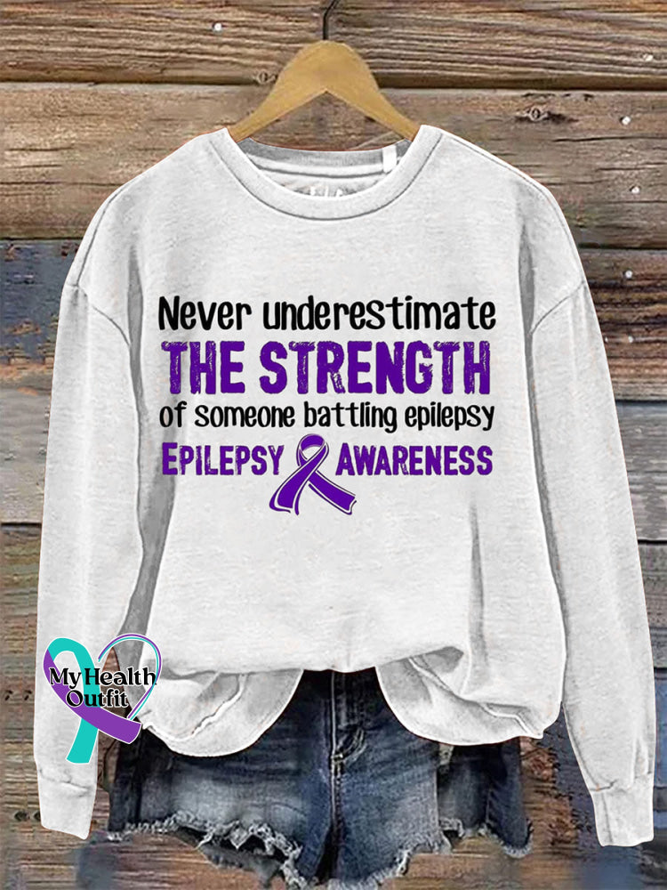 Never Underestimate The Strength Of Someone Batting Epilepsy Epilepsy Awareness Crew Neck Sweatshirt White / S