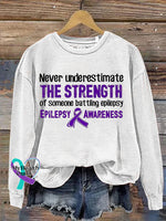 Never Underestimate The Strength Of Someone Batting Epilepsy Epilepsy Awareness Crew Neck Sweatshirt White / S