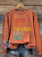 Women’s Don’t Let The Hard Days Win Printed Sweatshirt Pumpkin Orange / S