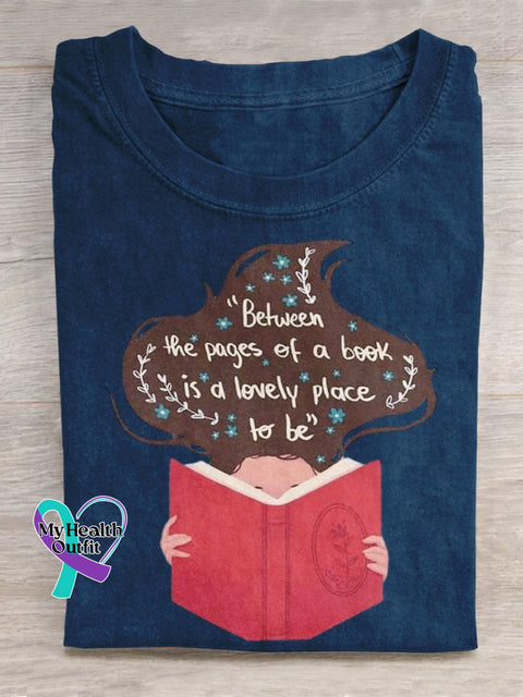 ’Between The Pages Of A Book Is Lovely Place To Be’ Lover Graphic Printed T-Shirt Blue / S