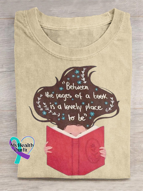 ’Between The Pages Of A Book Is Lovely Place To Be’ Lover Graphic Printed T-Shirt Sand / S