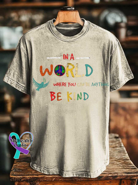 IN A WORLD WHERE YOU CAN BE ANYTHING BE KIND Peace Sign T-shirt Sand / S