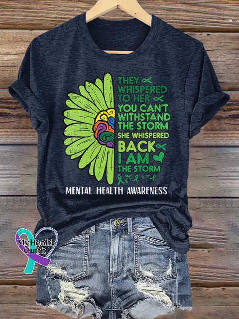 THEY WHISPERED TO HER YOU CAN’T WITHSTAND THE STORM SHE WHISPERED BACK I AM THE STORM Mental Health Awareness T-shirt