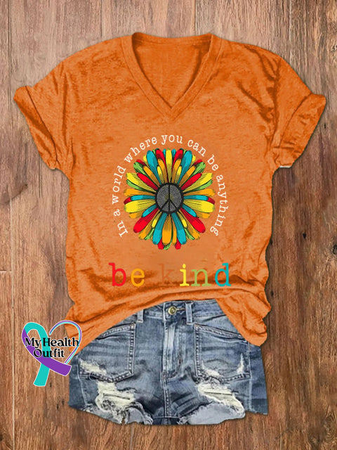 Women’s In A World Where You Can Be Anything Kind Print V-Neck T-Shirt Orange / S