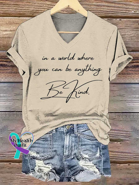 Women’s In A World Where You Can Be Anything Be Kind. V-neck Casual T-Shirt Sand / S