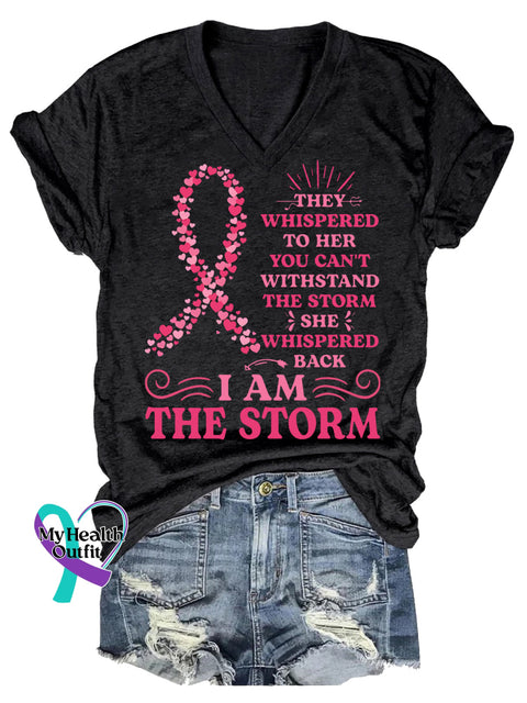 Women’s THEY WHISPERED TO HER YOU CAN’T WITHSTAND THE STORM SHE WHISPERED BACK IAM THE STORM Breast Cancer Awareness V