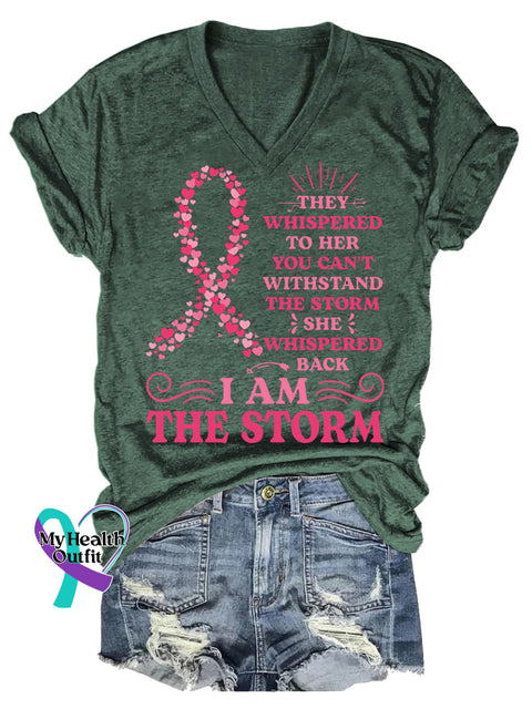 Women’s THEY WHISPERED TO HER YOU CAN’T WITHSTAND THE STORM SHE WHISPERED BACK IAM THE STORM Breast Cancer Awareness V