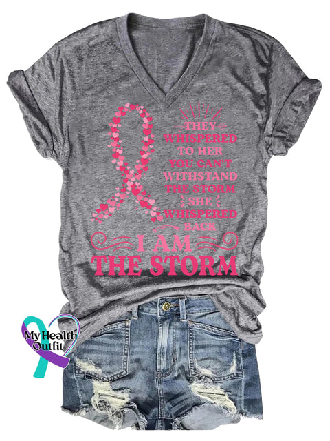 Women’s THEY WHISPERED TO HER YOU CAN’T WITHSTAND THE STORM SHE WHISPERED BACK IAM THE STORM Breast Cancer Awareness V