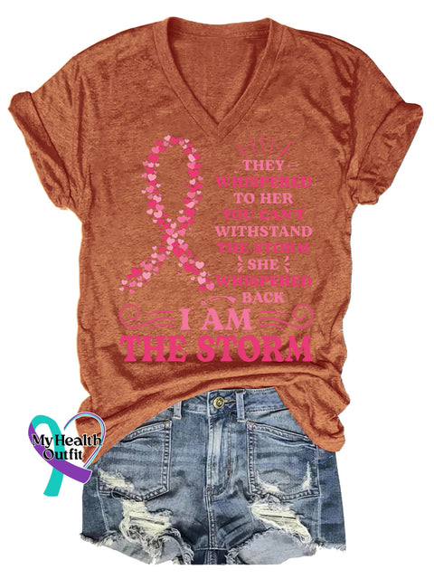 Women’s THEY WHISPERED TO HER YOU CAN’T WITHSTAND THE STORM SHE WHISPERED BACK IAM THE STORM Breast Cancer Awareness V