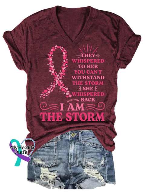 Women’s THEY WHISPERED TO HER YOU CAN’T WITHSTAND THE STORM SHE WHISPERED BACK IAM THE STORM Breast Cancer Awareness V